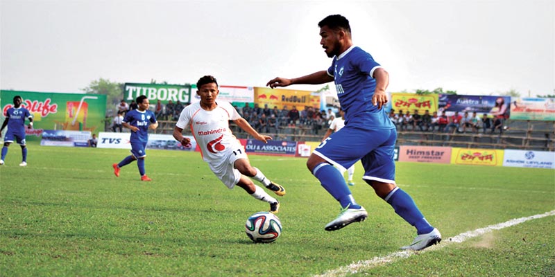 Action in the match between Nepal APF Club and Ruslan Three Star Club (right) during the third Rumpum Jhapa Gold Gup  Football Tournament at the Domalal Stadium in Birtamod on Monday, March 5, 2018. Photo: THT
