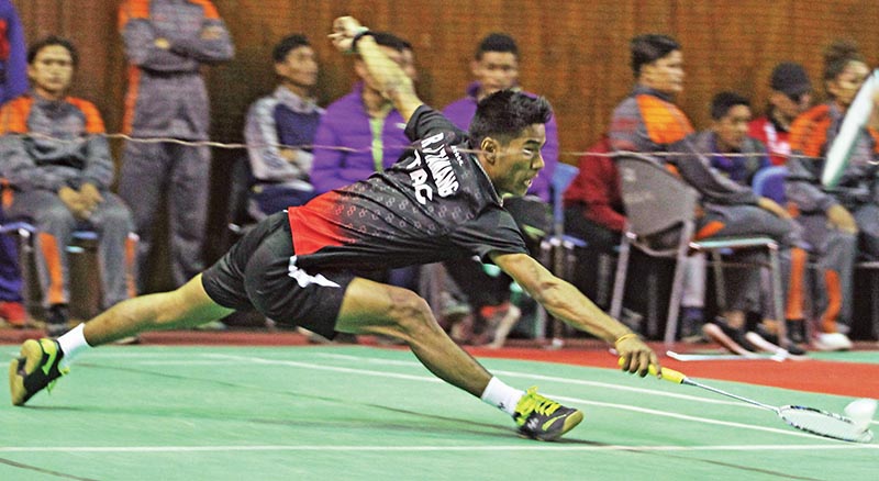 Ratnajit Tamang of Tribhuvan Army Club returns to Prince Dahal of Darchula in men's singles semi-final match during the Fourteenth Nationwide Kirshnamohan Memorial Open Badminton Tournament at Halchwok Stadium in Kathmandu on Wednesday. Photo: Udipt Singh Chhetry/ THT