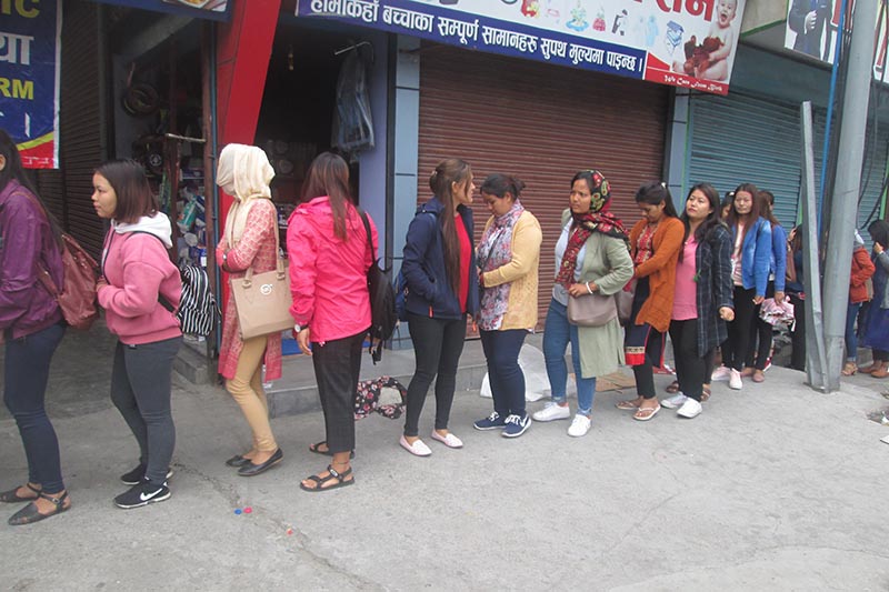 Youths queue up to submit applications of the Korean Language Test (KLT) under the Employment Permit System (EPS)‚ in New Road‚ Pokhara of Kaski district on Thursday‚ March 22, 2018. Photo: Rishi Ram Baral