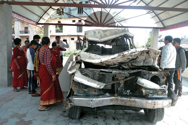 People looking at the remains of a jeep involved in Dashdhunga accident, at Madan Bhandari Museum, in Urlabari, Morang district, on Friday, March 30, 2018. Photo: RSS