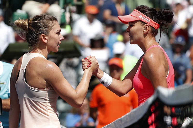 Agnieszka Radwanska of Poland (right) shakes hands with Simona Halep of Romania (left) on day five of the Miami Open at Tennis Center at Crandon Park, in Key Biscayne, Florida, USA, on March 24, 2018. Photo: Geoff Burke-USA TODAY Sports via Reuters