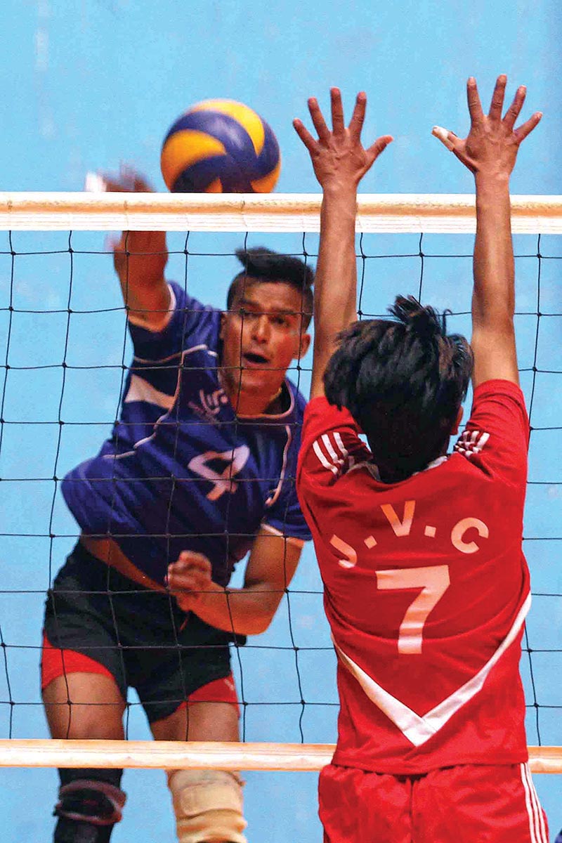 Amrit KC of Help Nepal attempts a spike against JVTC during their fourth NST-NVA National Club Volleyball Tournament match in Kathmandu on Thursday. Photo: Udipt Singh Chhetry/ THT