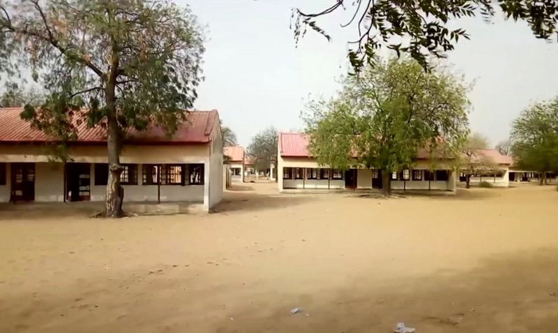 This image taken from video shows the exterior of Government Girls Science and Tech College in Dapchi, Yobe State, Nigeria on Thursday February 22, 2018. As a painful debate about school safety rages in the U.S., President Donald Trumpu0092s proposal to put more guns in schools carries echoes of the questions being asked in the northeast Nigeria. Determined to do something, the government has deployed armed guards to schools as parents debate the merits of giving guns to teachers themselves. Photo: AP