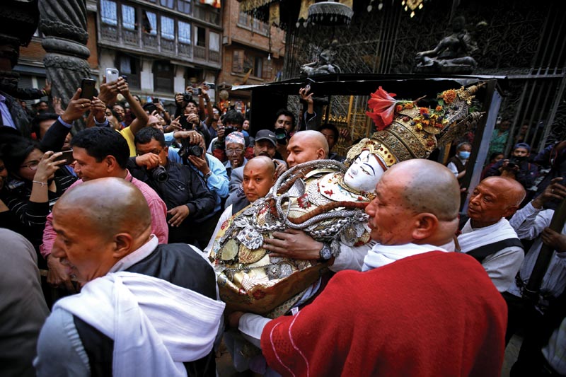 Priests carry the idol of deity Seto Machindranth to be placed inside the chariot during the Seto Machindranath chariot festival in Kathmandu, Nepal on Sunday, March 25, 2018.
