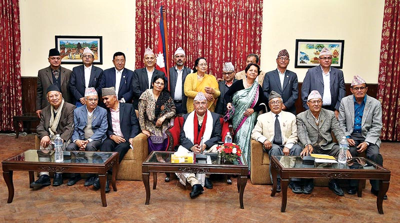Prime Minister KP Sharma Oli posing for a picture with former lawmakers in Baluwatar, Kathmandu, on Saturday. Photo: RSS