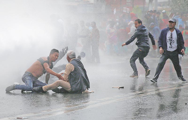 Water cannon being fired towards protesters to disperse the crowd during a protest against the road expansion projects causing people in the affected areas to lose their houses and lands in Kathmandu, on Wednesday, March 28, 2018. Photo: Reuters