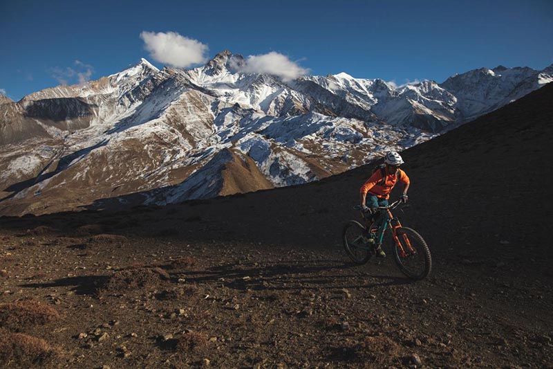 This undated image shows Rajesh Magar exploring the Himalayas on  mountain bike. Photo: National Geographic