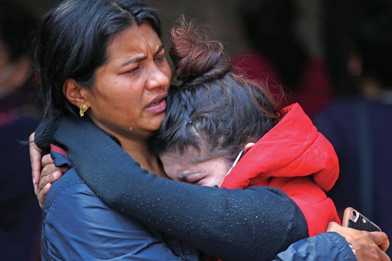 Family members mourn the death of their relative following the US-Bangla Airlines crash killing 49 people outside the Post Mortem at Teaching Hospital in Kathmandu on Tuesday, March 13, 2018. Photo: Skanda Gautam/THT