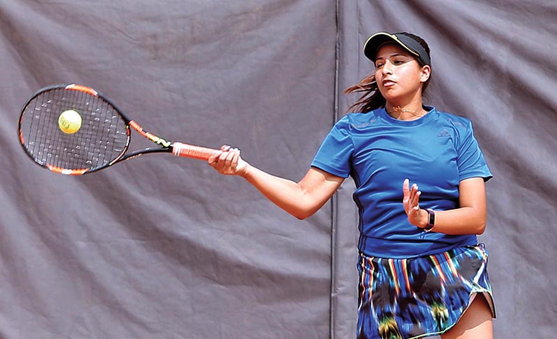 Mayanka Rana returns to Anne Mathema during the womenu2019s singles match of the 10th Sahabir Memorial Open Lawn Tennis Championship in Kathmandu on Monday. Photo: THT