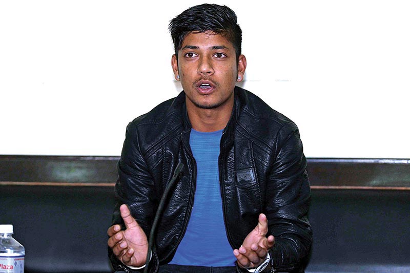 Nepali cricketer Sandeep Lamichhane gestures during a press meet in Kathmandu on Monday, on the eve of his departure to India. Photo: Udipt Singh Chhetry/ THT