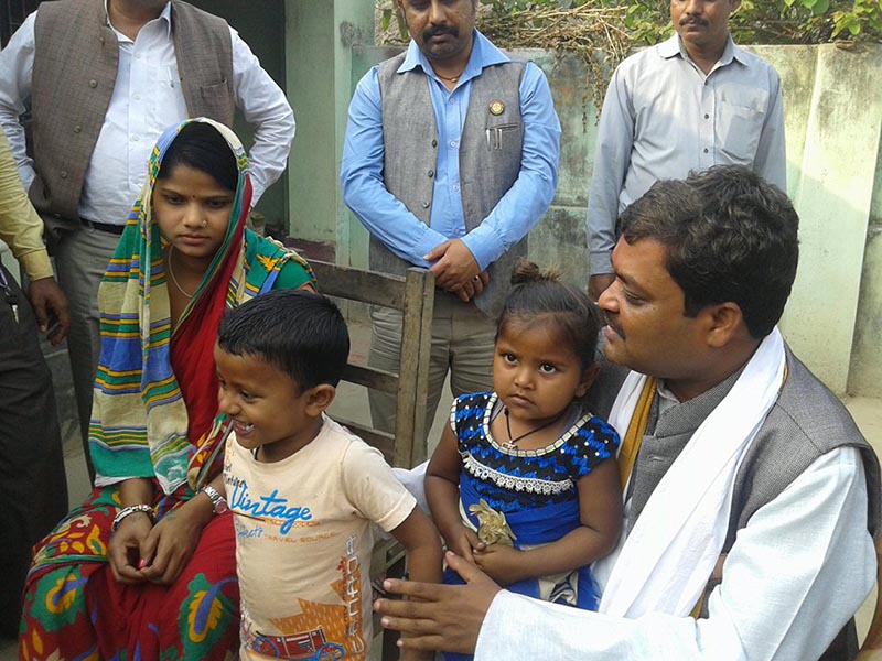 Minister for Agriculture and Land Management in Province 2, Shailendra Prasad Sah (right) carries Arya Raut, a three-year-old daughter of Rajib Raut, the martyr to the Madhesi movement, beside the deceased's son Aryan and wife Neelam, in Bhardaha, Saptari district, on Monday, March 5, 2018. Minister Sah paid homage to the martyr's family members. Photo: Byas Shankar Upadhyay