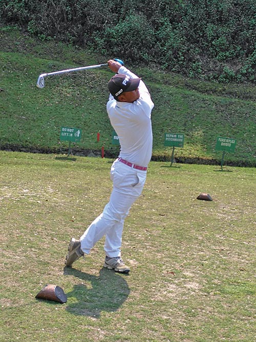 Tanka Bahadur Karki plays a shot during the first round of the  eighth Nepal Open Amateur Golf Championship at the Gokarna Golf Club in Kathmandu on Wednesday.