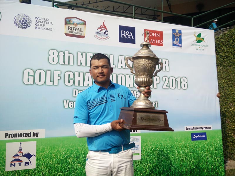 Tanka Bahadur Karki holds the trophies after the eighth Nepal Amateur Open Golf Championship in Kathmandu on Friday, March 23, 2018. Photo: THT
