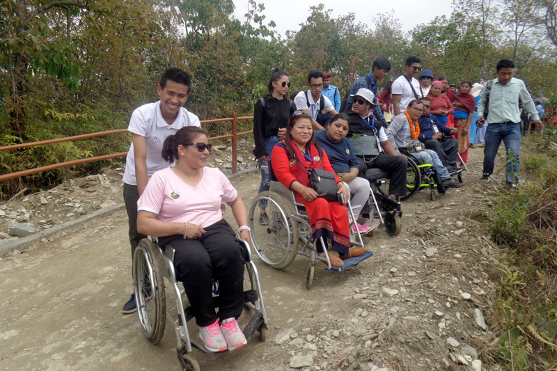 People with disabilities trek on the newly inaugurated trekking route, which is constructed targeting differently-abled people, in Annapurna rural Municipality-1, Pokhara, on Saturday, March 31, 2018. Photo: RSS