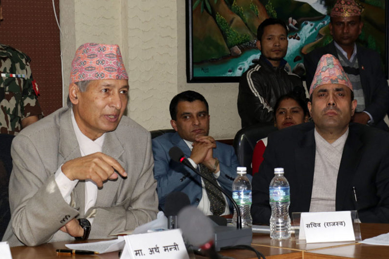 Finance Minister Yubaraj Khatiwada briefing mediapersons on the white paper issued by the government, in Kathmandu, on Friday, March 30, 2018. Photo: RSS