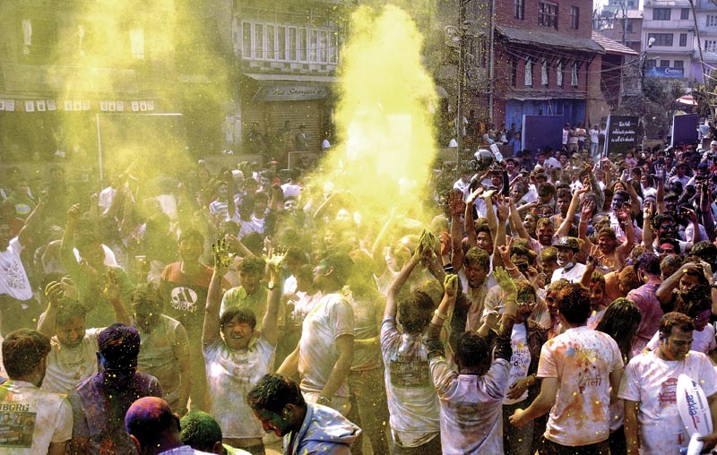 People throwing coloured powder. Photo: THT