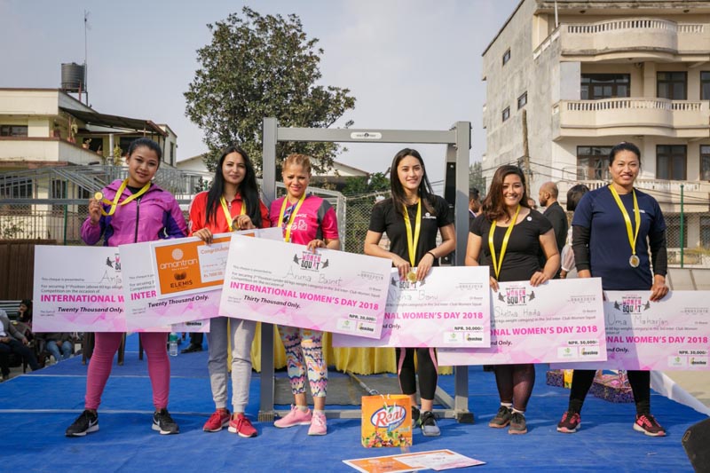 Winners of the 3rd Period Power Inter-club Women's Squat Competition display prizes while posing for photo at Heritage Garden in Sanepa , Lalitpur, on March 8, 2018. Photo: Fotomandu