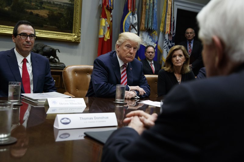 File - Tom Donohue, President and CEO, U.S. Chamber of Commerce, foreground, speaks as Treasury Secretary Steve Mnuchin, left, President Donald Trump, second from left, and Karen Kerrigan, President and CEO, Small Business &amp; Entrepreneurship Council, listen during a meeting in Washington on Oct. 31, 2017. Photo: AP