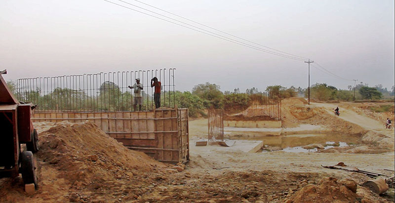 Labourers working for the construction of the bridge along the Postal Highway in Saptari district, on Tuesday, March 6, 2018. Photo Byas ShankarUpadhyay