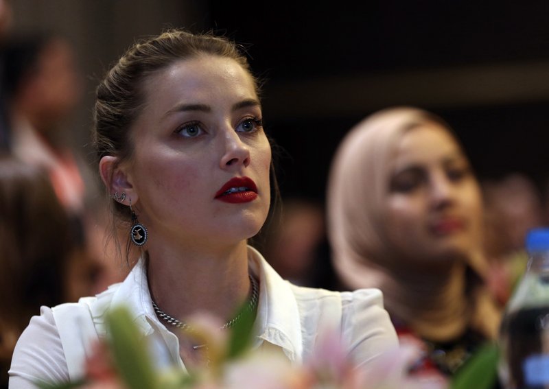 American actress Amber Heard looks on after meeting with Syrian refugees and medical volunteers in Amman, Jordan, on Thursday, April 5, 2018. Photo: AP