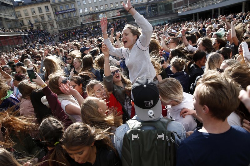 Fans of DJ Avicii gather at Sergels Torg following the news of his death, in central Stockholm, Sweden, on Saturday, April 21, 2018. Photo: AP