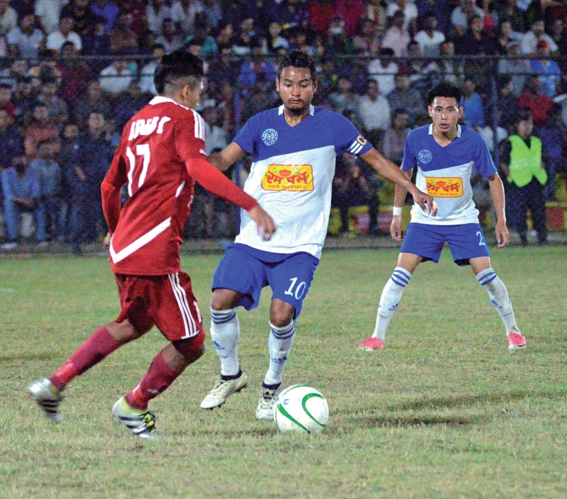 Players of TAC and Jhapa-XI (right) vie for the ball during their Birat Gold Cup match in Biratnagar on Friday, April 6, 2018. Photo: THT