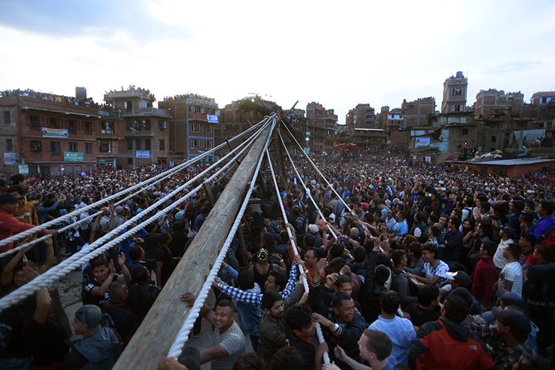 Devotees erecting lingo during Bisket Jatra, in Bhaktapur, on Friday, April 13, 2018. The lingo is erected on the eve of the Nepali New Year bidding farewell to the year gone by. Photo: THT