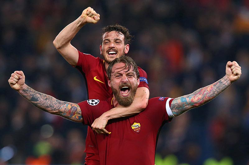 Roma's Daniele De Rossi and Alessandro Florenzi celebrate after the Champions League quarter Final Second Leg match between AS Roma and FC Barcelona,  at Stadio Olimpico, in Rome, Italy, on April 10, 2018. Photo: Reuters