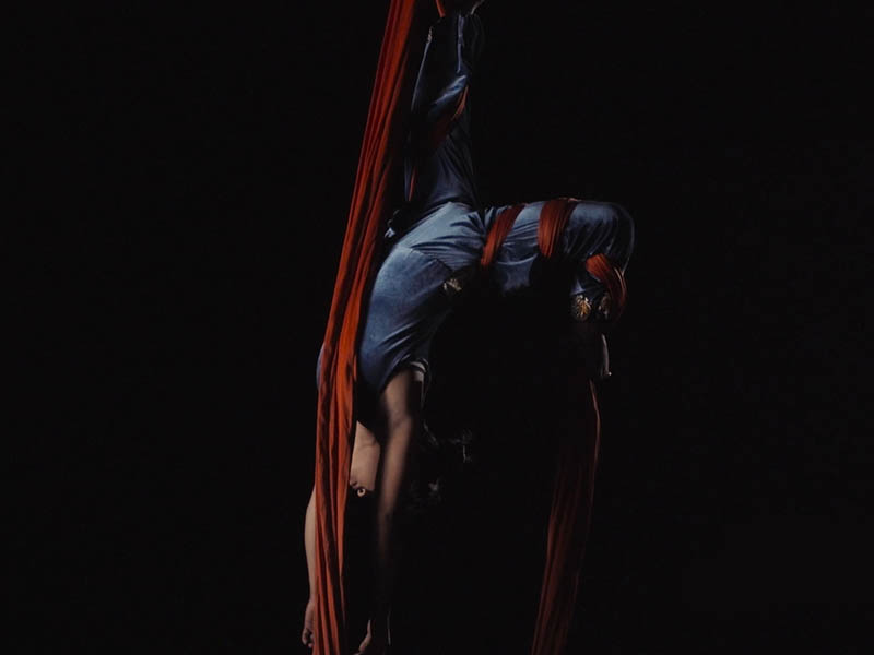 Circus Kathmandu performer Sheetal performs her aerial work on red silks. Photo: Reuters