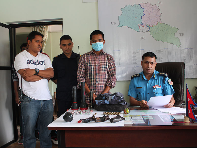 Police making public the suspect along with seized arms and ammunitition at the Makwanpur District Police Office, on Thursday, April 19, 2018. Photo: Prakash Dahal