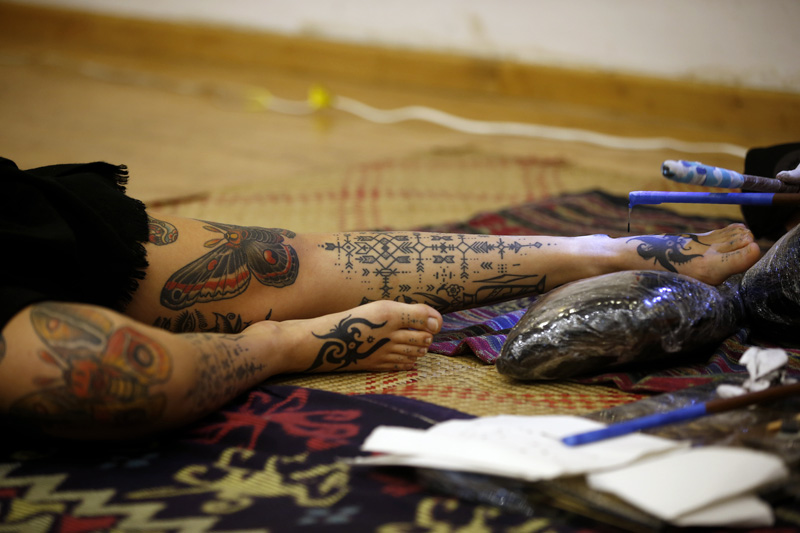 An artist works on a tattoo during the International Nepal Tattoo Convention in Kathmandu, on Saturday, April 07, 2018. Photo: Skanda Gautam