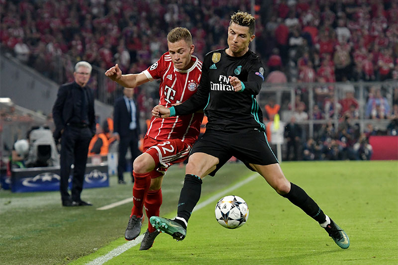 Bayern Munich's Joshua Kimmich in action with Real Madrid's Cristiano Ronaldo. Photo: Reuters
