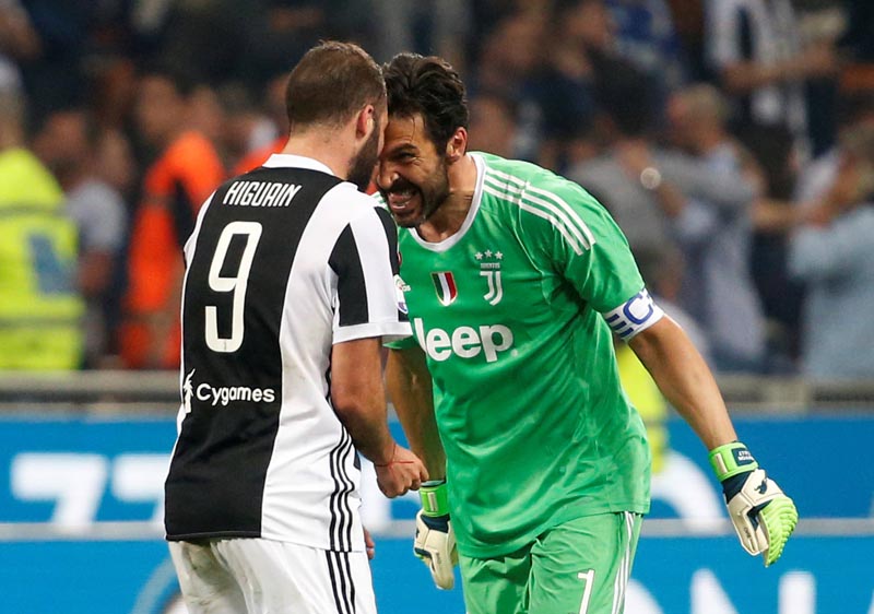 Juventus' Gianluigi Buffon and Gonzalo Higuain celebrate after Serie A match between Juventus and  Inter Milan, at San Siro, Milan, Italy, on April 28, 2018. Photo: Reuters