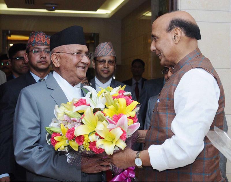 Minister for Home Affairs of India Rajnath Singh (left) welcomes Prime Minister KP Sharma Oli upon  his arrival at Indira Gandhi International Airport, in New Delhi, India, on Friday, April 6, 2018. Prime Minister Oli is on three-day state visit to India. Photo: MEAIndia Twitter