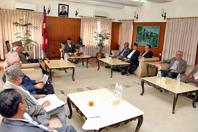 Prime Minister KP Sharma Oli (centre) holding meeting with former premiers and foreign experts before embarking on official visit to India, at Baluwater, Kathmandu, on Wednesday, April 04, 2018. Photo: RSS