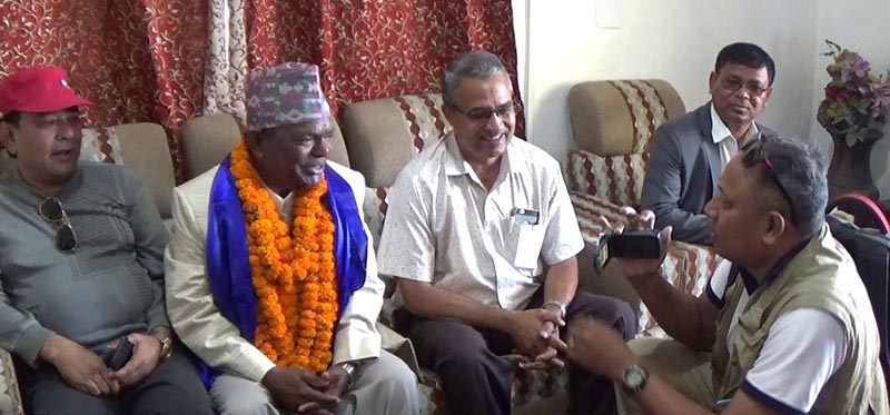 Minister for Federal Affairs and General Administration Lalbabu Pandit talking to mediapersons at Biratnagar airport, on Tuesday, April 10, 2018. Photo: THT
