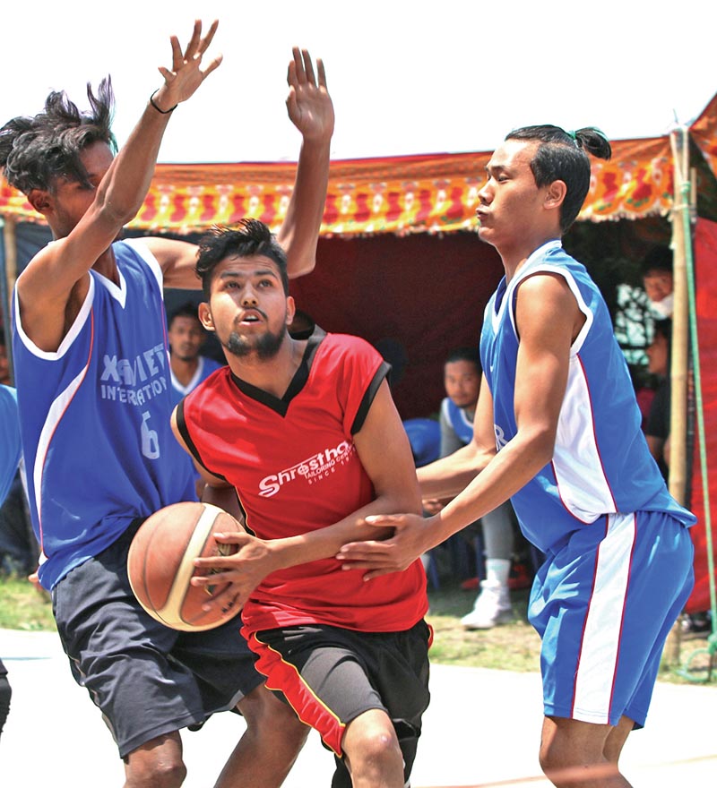 Action in the match between Xavier International and NSF (centre) during the first Manamohan Memorial Open Basketball Tournament in Kathmandu on Sunday. Photo: THT