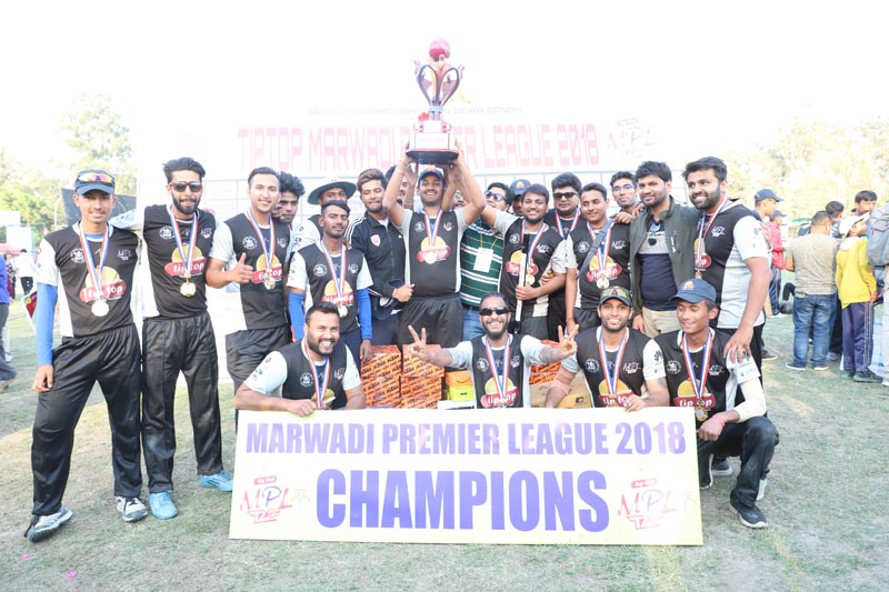 Fighters team members celebrate with the trophy after the Marwadi Premier League at the TU Stadium in Kathmandu on Saturday, April 14, 2018. Photo: THT