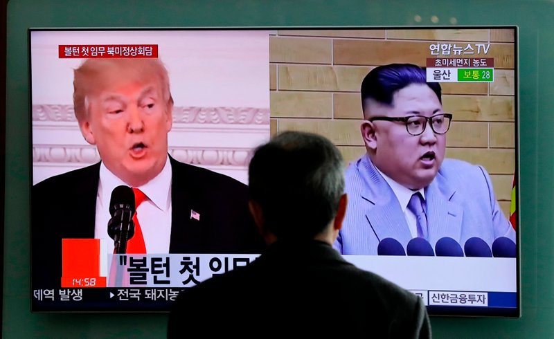 File - In this photo, a man watches a TV screen showing file footages of US President Donald Trump, left, and North Korean leader Kim Jong Un during a news program at the Seoul Railway Station in Seoul, South Korea on March 27, 2018. Photo: AP