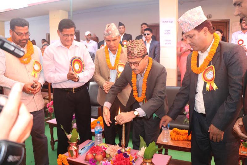 Province 7 Chief Minister Trilochan Bhatta lighting a lamp during a programme in Kailali Multiple Campus, on Friday, April 13, 2018. Photo: THT