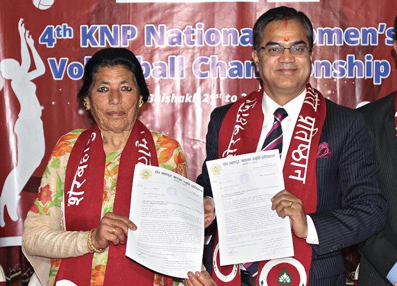 Patron of Sher Bahadur Khadka Memorial Foundation Gamali Khadka (left) and CEO of Globel IME Bank Janak Sharma Poudel exchanging the MoU during a signing ceremony in Kathmandu on Tuesday. Photo: THT