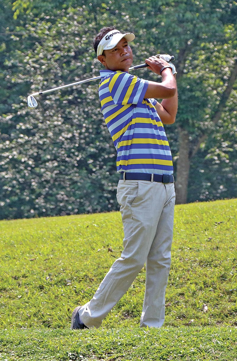 Bhuwan Nagarkoti plays a shot during the second round of the Surya Nepal NPGA Tour Championship at the Gokarna Golf Club in Kathmandu on Tuesday. Photo: THT