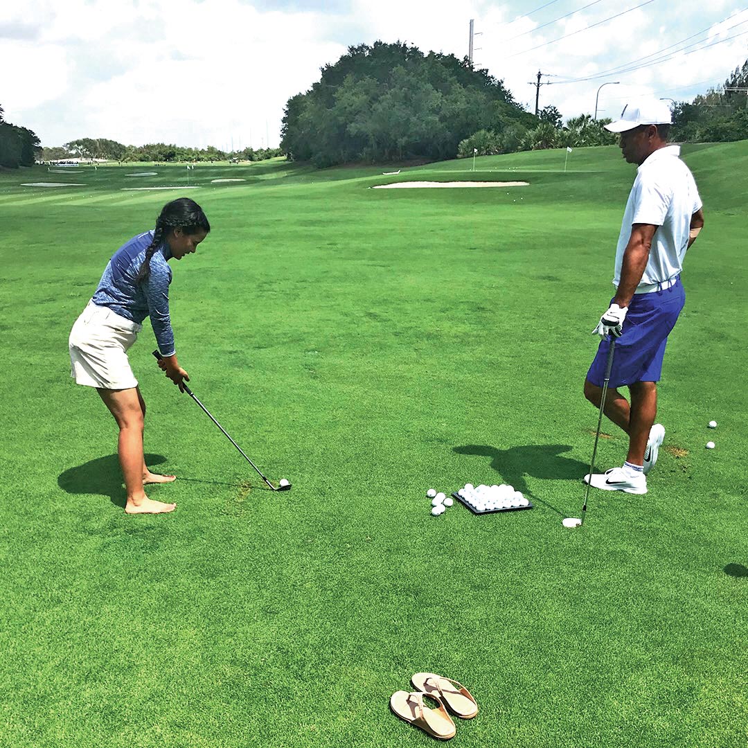 Tiger Woods gives golfing lesson to pratima Sherpa in Florida on Tuesday. Photo Courtesy: Tiger woods' twitter