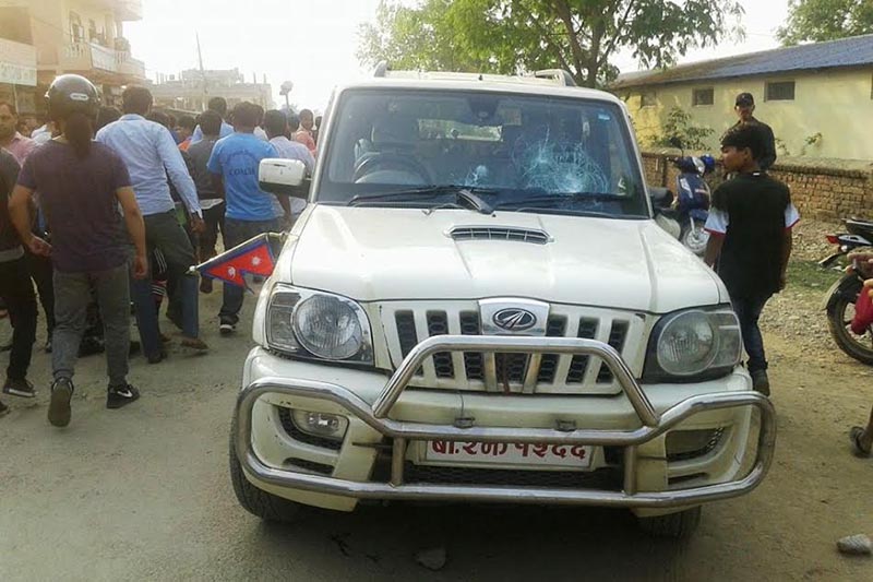 Agitating students vandalising a vehicle belonging to Physical Infrastructure Development Minister Khadga Bahadur Khatri of Karnali province, in Birendranagar, Surkhet, on Wednesday, April 4, 2018. Photo: THT