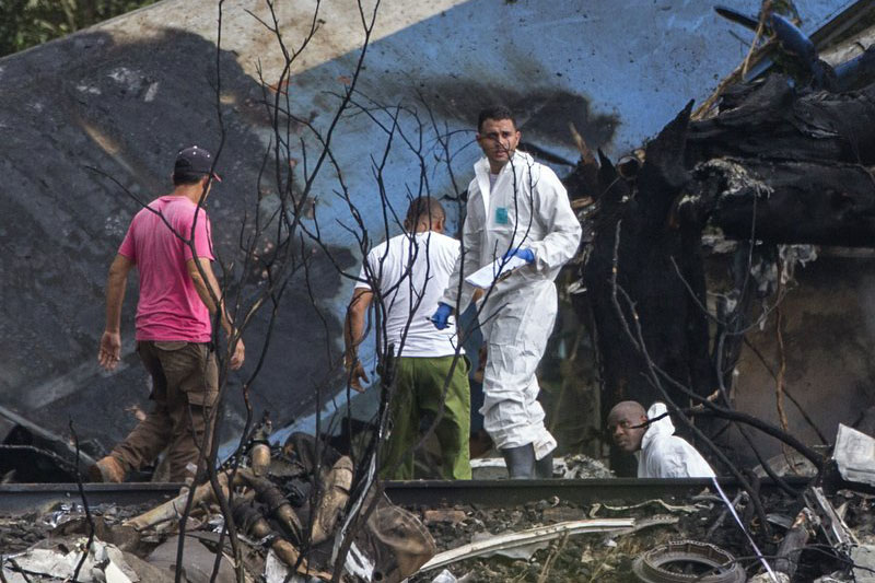 Investigators at the incident site in Cuba. Photo: AP