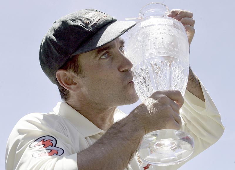Australia's Justin Langer kisses the Ashes trophy as he celebrates winning the cricket series against England in Sydney, on January 5, 2007. Photo: AP/ File