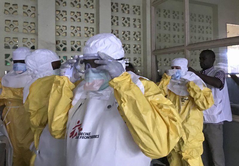 In this photo taken, a team from Medecins Sans Frontieres (Doctors Without Borders) dons protective clothing and equipment as they prepare to treat Ebola patients in an isolation ward of Mbandaka hospital in Congo on  Sunday, May 20, 2018. Photo: AP