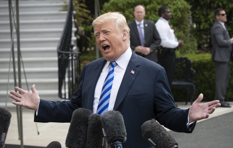 President Donald Trump talks to the media as he leaves for Dallas to address the National Rifle Association at the White House in Washington on  Friday, May 4, 2018. Photo: AP