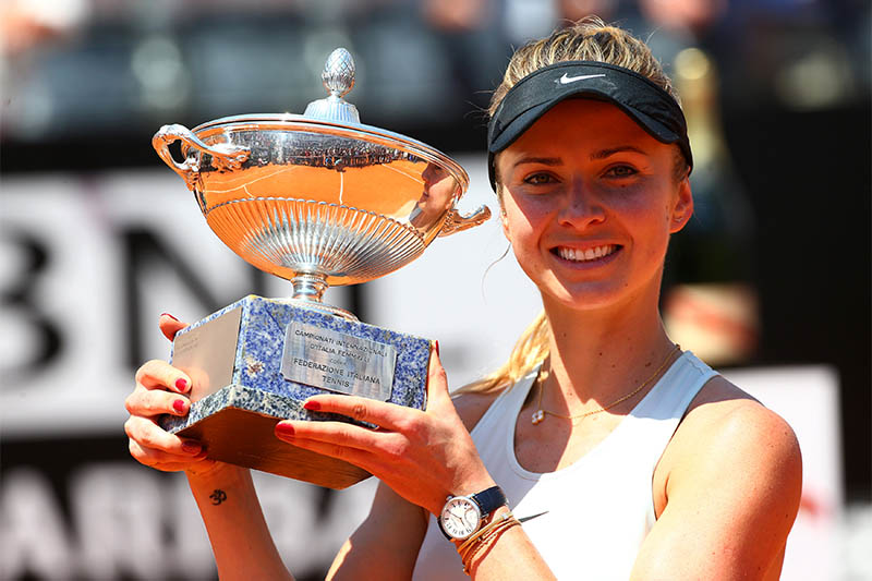 Ukraine's Elina Svitolina celebrates with the trophy after winning the final against Romania's Simona Halep. Photo: Reuters