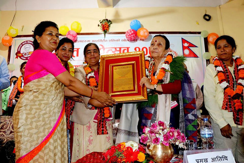 Aadarshanari Bikas Kendra, Chitwan, felicitating Province 3 Governor Anuradha Koirala, on Wednesday, May 30, 2018. Photo: RSS
